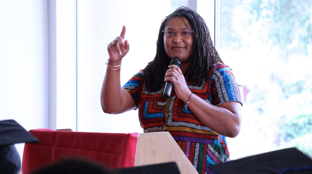 PC alumna Cynthia Olley '00 reflects on her journey of perseverance and resilience during the 2026 Mosaic Ceremony.