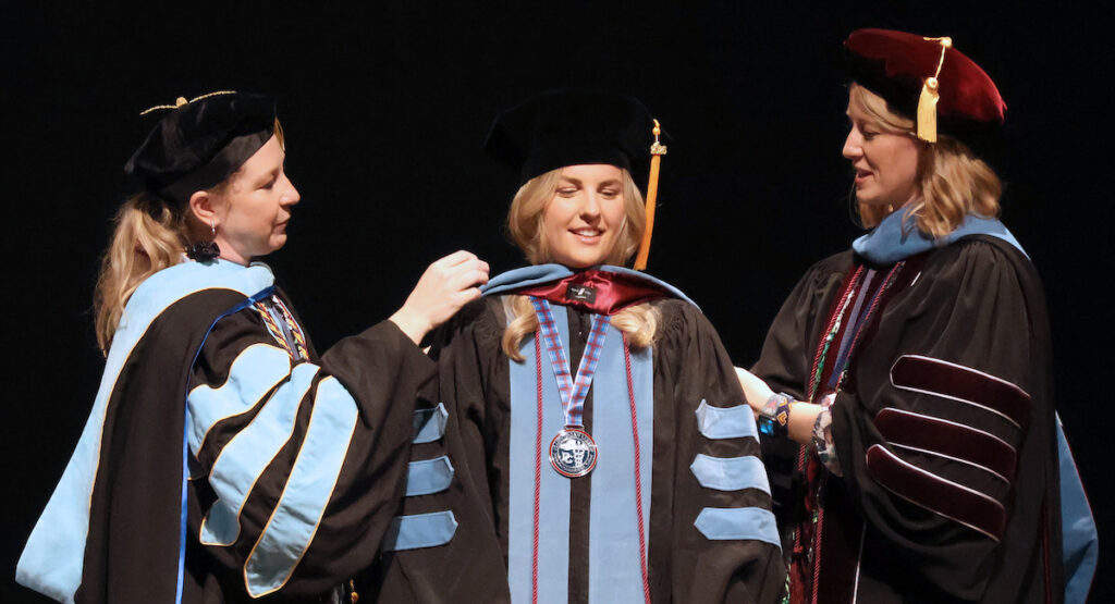 A member of the fourth cohort of Occupational Therapy Doctoral program is hooded on May 2 and will now go into the world to transform lives.