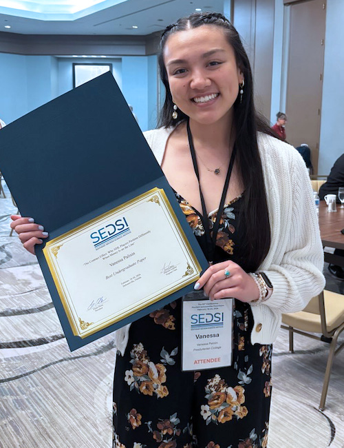 Presbyterian College senior Vanessa Palisin with her first place award at the Southeast Decision Sciences Institute annual conference in Jacksonville, Fla.