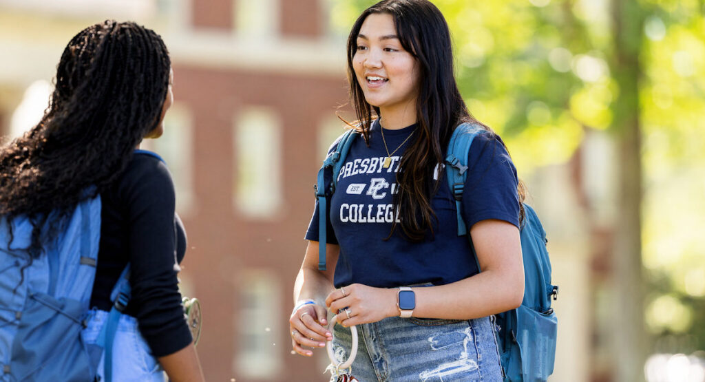 Vanessa Palisin '26 talking to a fellow student on campus.