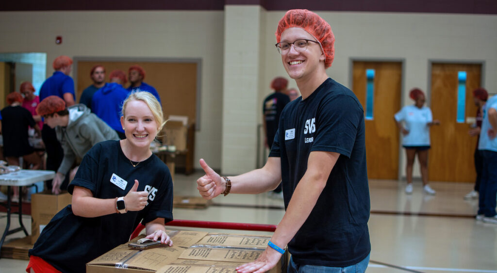 Student Volunteer Service leaders (left to right) MC Lominack and Lyle Jones at the Rise Against Hunger event at First Presbyterian Church in Clinton.