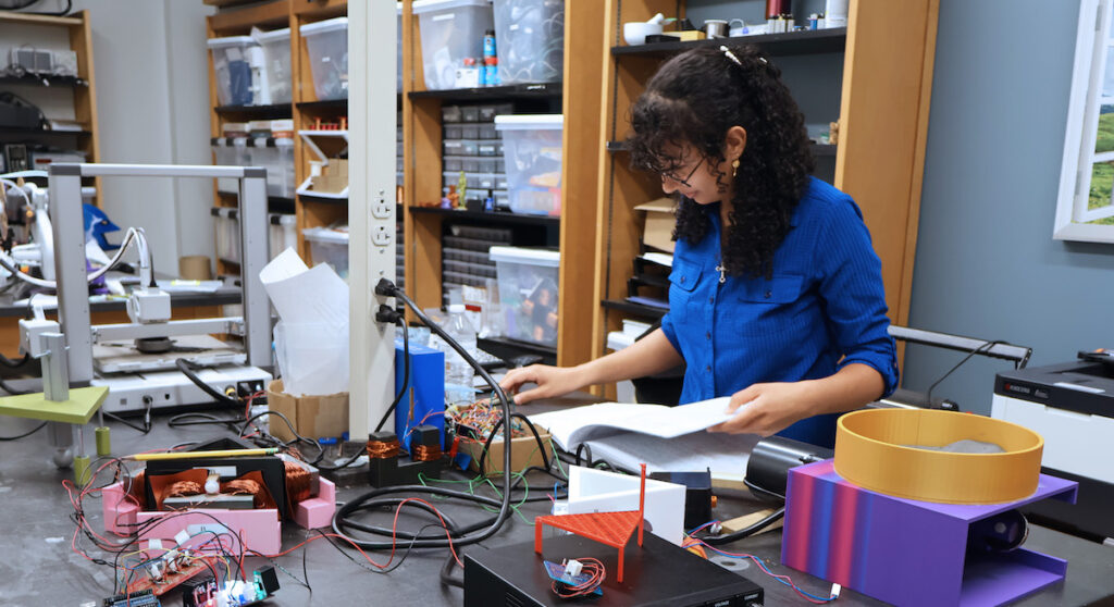 PC student Veby Youssef working in a physics laboratory in Richardson Hall conducting summer research through a NASA grant.