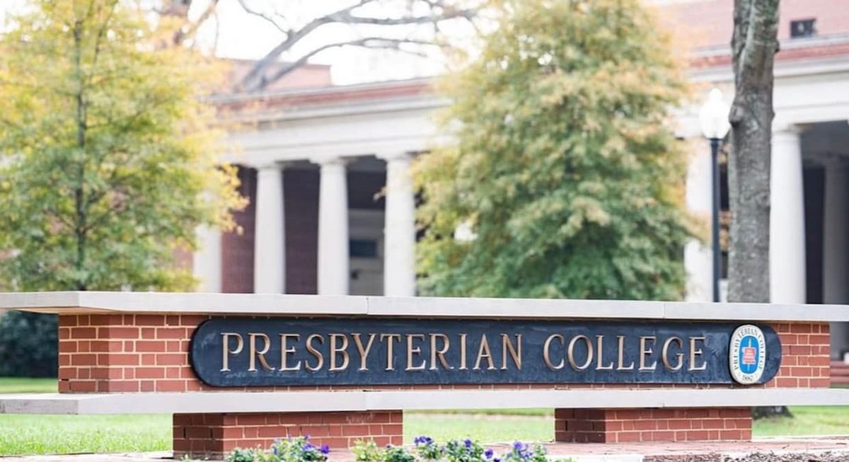 Presbyterian College sign facing Broad Street with Belk Auditorium in the background.