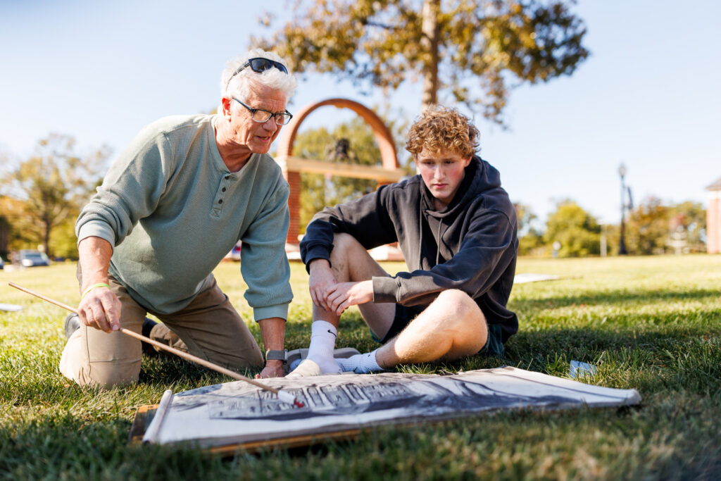 Presbyterian College Art Professor Paquin with art student discussing student's drawing
