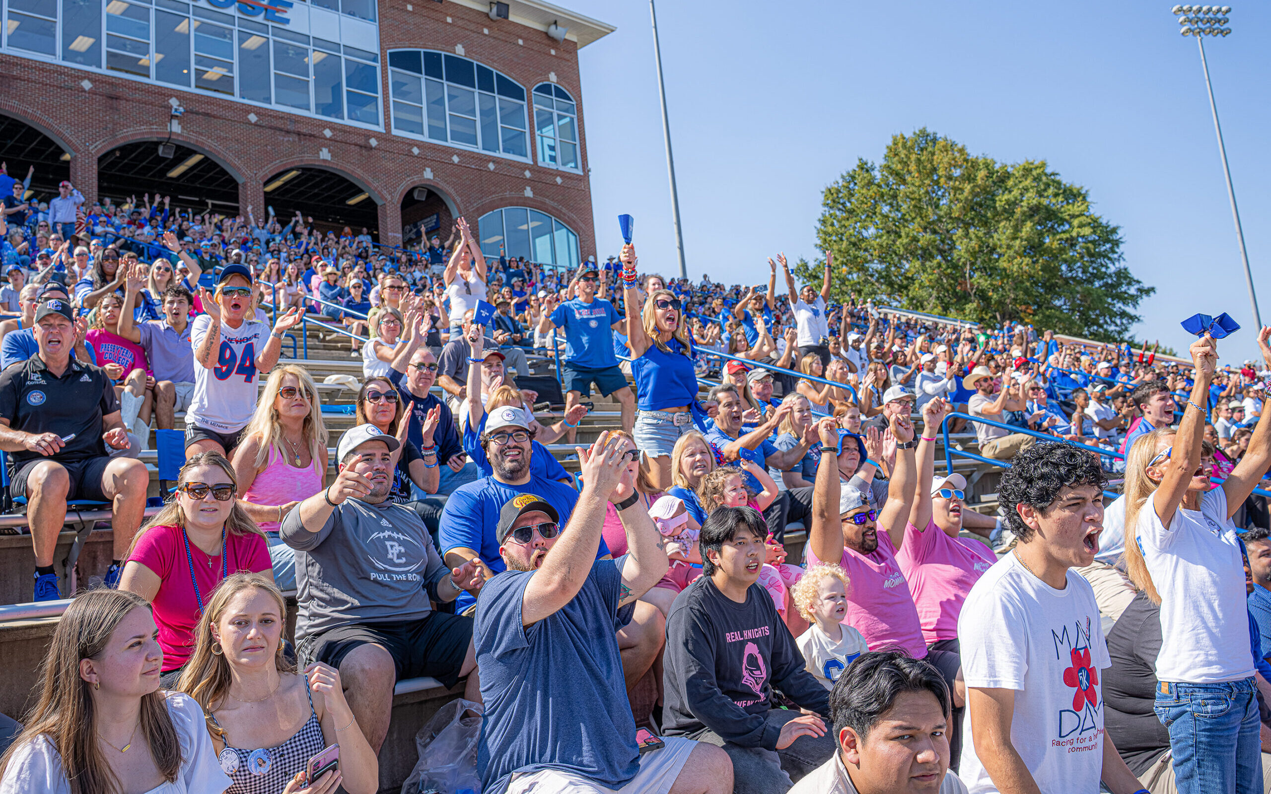 Fans cheering at a Presbyterian College homecoming football game