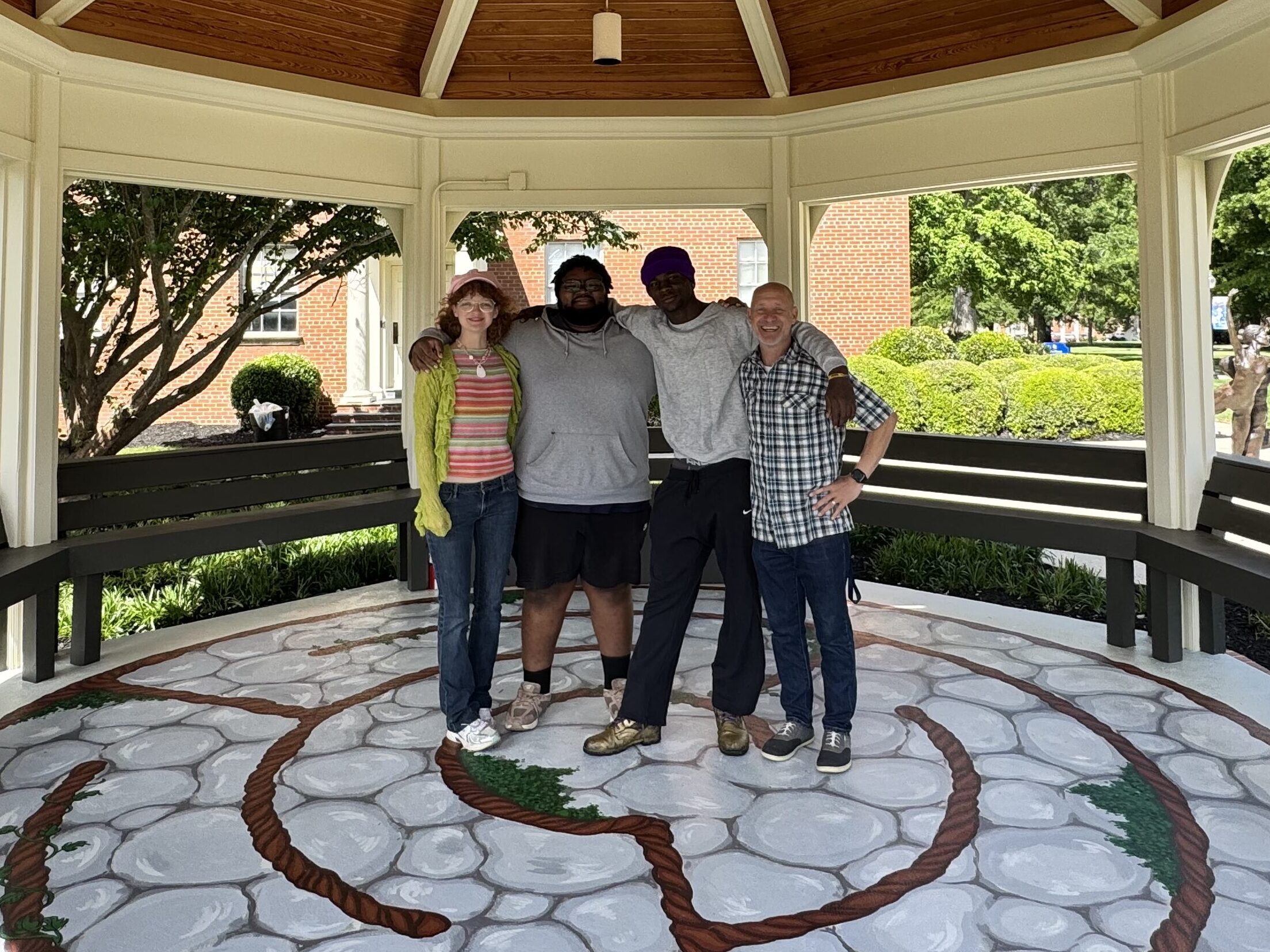 Presbyterian College art students with Professor Slagle at the completed Peace Pavilion labyrinth mural they designed and painted on the PC campus.