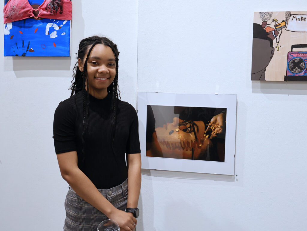 Presbyterian College art student with their work in the annual Student Art Exhibition at PC’s  Elizabeth Stone Harper Gallery in Harper Center.