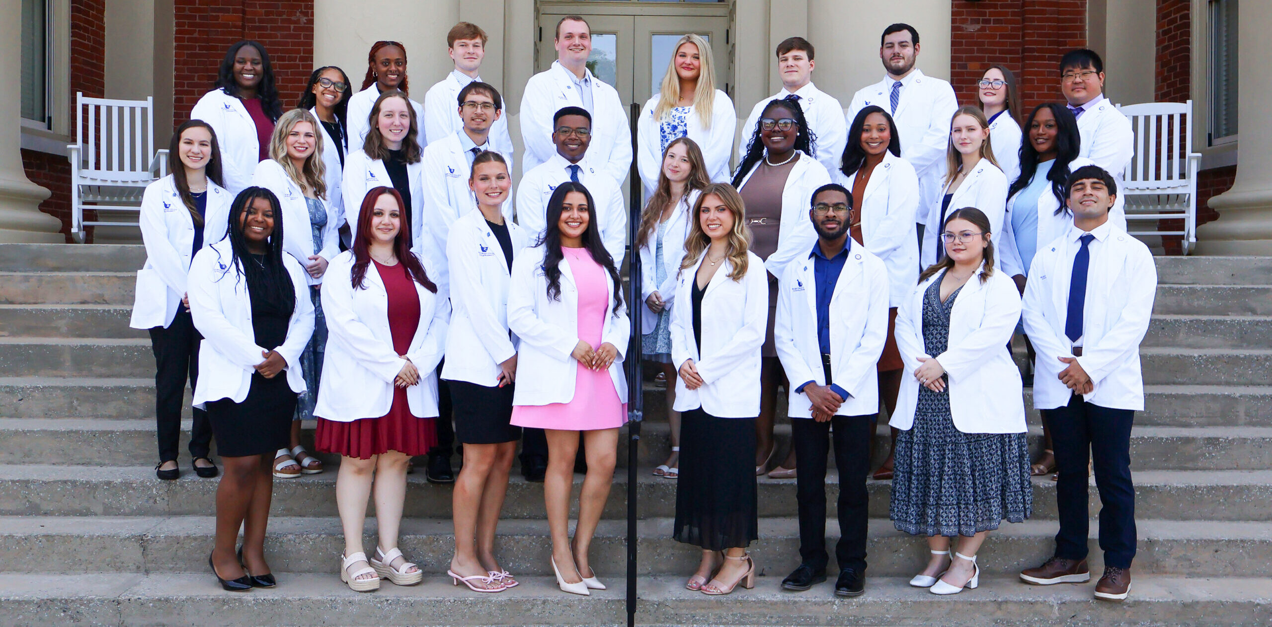Presbyterian College PharmD students pose for a group picture with their new white coats on campus in South Carolina.