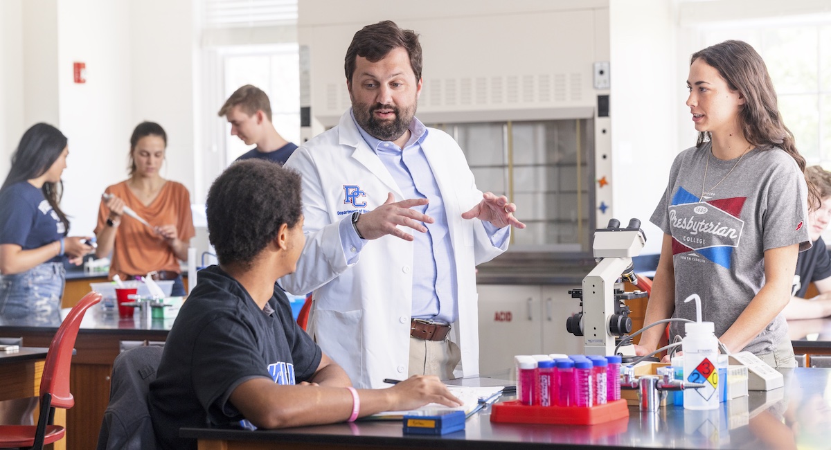 PC biology professor Dr. Austin Shull in class with students.