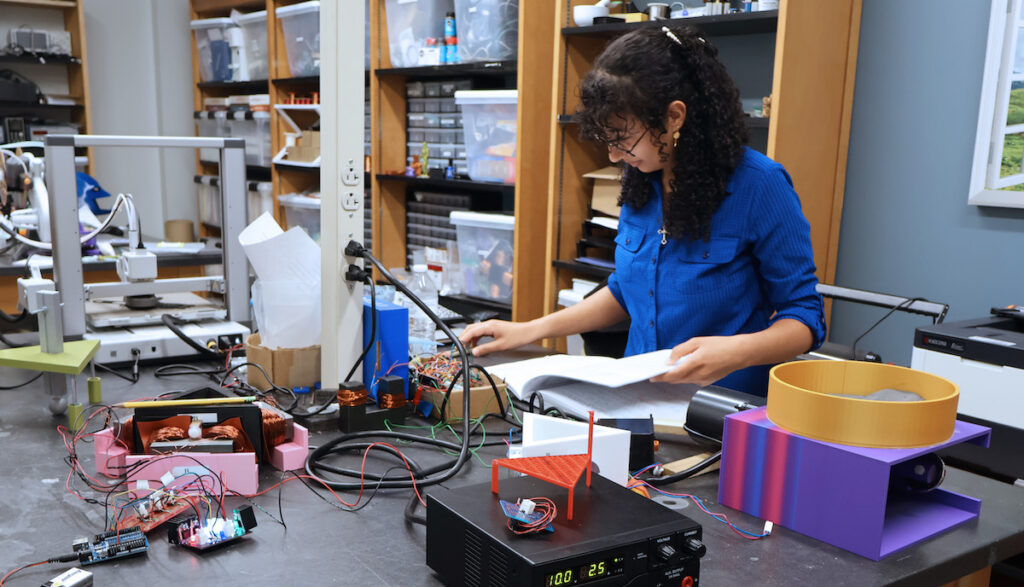 PC student Veby Youssef working on physics research.