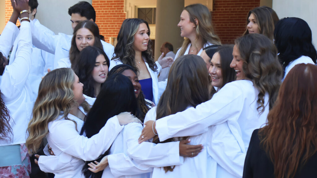 The Class of 2027 for the PC PA program celebrate following their White Coat Ceremony.