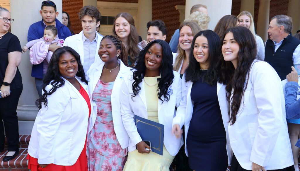 PC physician assistant students pose for photos after their white coat ceremony.