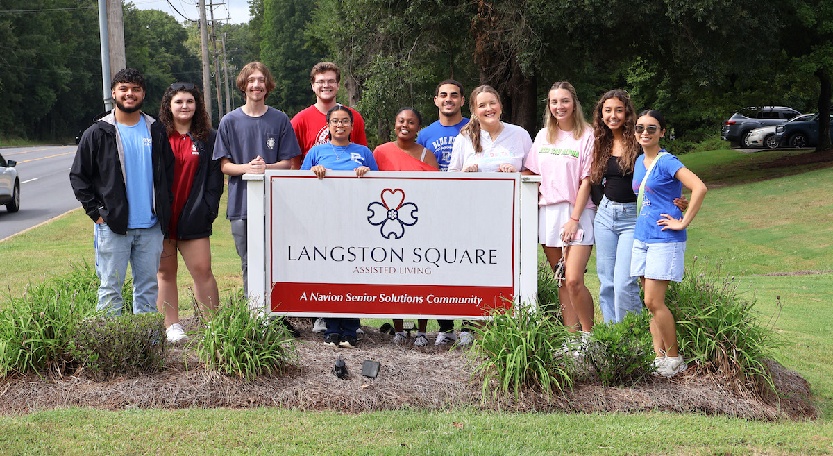 PC students volunteering at Langston Square during fall Service Day.
