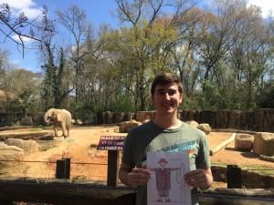 Caleb McGill visits the zoo with Flat Stanley.